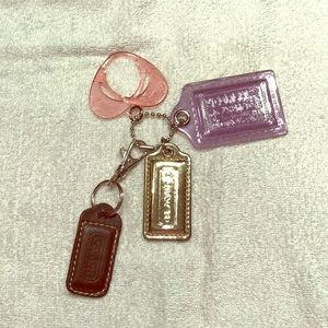FourAuthentic Coach Charms